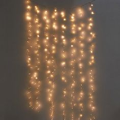 there is a string of lights hanging on the wall