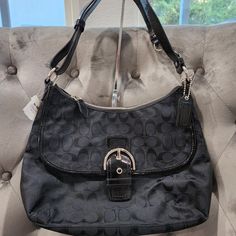 Nwt Coach Soho Signature Black/Silver Flap Duffle Bag 23164e Never Used, Tags Still Attached. Great Gift For A Birthday, Anniversary Or Mothers Day. I Will Include A Dust Cover, If You Don't Ask Me To Drop My Price. Perfect For That Fashionista Or Timeless Zipper At The Top With Coach Hang Tag, Adjustable Strap, Can Be Longer Or A Shoulder Bag. Front Flap With Pocket - 2 Interior Wall Pockets Without Zipper- 1 Interior Wall Pocket With Zipper - Purple Lining Bag Height: 9.5" Bag Length: 13.25" B Silver Elegant Hobo Bag For Everyday Use, Elegant Silver Hobo Bag For Everyday Use, Silver Hobo Bag With Silver-tone Hardware For Evening, Elegant Silver Hobo Bag With Silver-tone Hardware, Silver Hobo Bag For Everyday Use, Elegant Silver Hobo Bag For Travel, Elegant Silver Hobo Bag For Shopping, Silver Hobo Bag With Silver-tone Hardware For Everyday, Everyday Silver Hobo Bag With Silver-tone Hardware