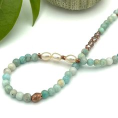 Gold Amazonite Gemstone Layering Necklace – Violet Tiger Spiritual Necklace With Pearl Pendant And Round Beads, Spiritual Pearl Pendant Necklace, Spiritual Pearl Necklace With Round Beads, Spiritual Pearl Necklace With Natural Stones, Spiritual Single Strand Pearl Necklaces, Adjustable Spiritual Pearl Necklace With Natural Stones, Spiritual Pearl Drop Necklace With Round Beads, Elegant Amazonite Bead Necklaces, Healing Pearl Beaded Necklace With Natural Stones