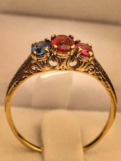 "Very unique handmade gold ring with real gamstones . 14k gold antique victorian ring with a real garnet stones in the middele + 1 real beautiful ruby in the side + one real beautiful sapphire on the other side . Hand made by myself Weight : about 1.9 gram Central stone : garnet 4/6 m\"m Ruby stone : 3/5 mm Sapphire stone : 3/5 mm" Rose Gold Pearl Ring, Antique Rings Victorian, Handmade Gold Ring, Ruby Bands, Gold Pearl Ring, Victorian Ring, Rose Gold Pearl, Victorian Rings, 14k Rose Gold Ring