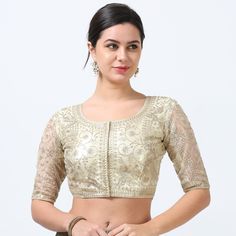 Elevate your saree ensemble with our stunning Shiny Gold Saree Blouse, designed to add a touch of opulence to your traditional attire. Crafted from high-quality satin with a lustrous finish, this ready-made blouse promises a perfect blend of elegance and comfort. Please be aware that color variation may occur due to lighting and screen effects. Fabric:Silk Blend Lining:Yes Padding: Yes Size:34 to 46 Sleeve Length:Above Elbow Front Neck:Round Back Neck: Round Closure:Front Special Feature: Beautiful Work and Sheer Panel on the back Gold Saree Blouse, Gold Saree, Blouse Designed, Above Elbow, Readymade Saree, Gold Blouse, Organza Sarees, Blouse Neck Designs, Blouse For Women