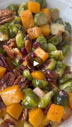 brussel sprouts, brussels sprouts, and walnuts in a white bowl