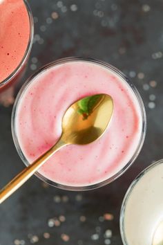 two glasses filled with pink and white liquid