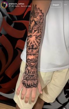 a man's arm with tattoos on it and the words don't be afraid to