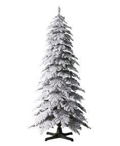 a tall white christmas tree with snow on it's branches and two black legs