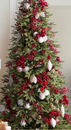 a christmas tree with red and white ornaments