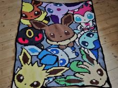 the pokemon blanket is on the floor with many different characters around it, including pikachu and eebi