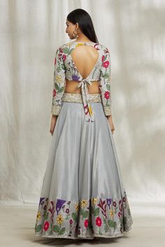 Grey attached cancan lehenga with floral placement print and embroidered waistband. Paired with sequin, bead, star flower, pearl embroidered padded blouse and purple leheriya pattern dupatta.
Components: 3
Pattern: Printed, Embroidery
Type Of Work: Floral, sequin, bead, pearl
Neckline: Round
Sleeve Type: Full sleeves
Fabric: Lehenga and Blouse: Silk, Dupatta: Organza, Lining: Butter Crepe
Color: Grey
Other Details: 
Lehenga:
Attached cancan
Floral pattern
Length: 42 inches
Blouse:
Padded
Back ti Floor-length Fitted Choli With Floral Embroidery, Fitted Floor-length Choli With Floral Embroidery, Fitted Anarkali Choli With Floral Embroidery, Floor-length Silk Choli With Floral Embroidery, Fitted Choli With Floral Embroidery And Traditional Drape, Grey Lehenga, Bead Star, Cancan Lehenga, Lehenga And Blouse