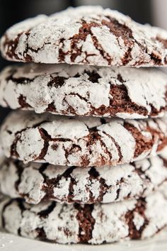 chocolate crinkle cookies stacked on top of each other