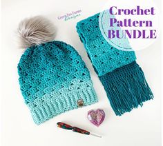 a crocheted hat and scarf with a pom - pom