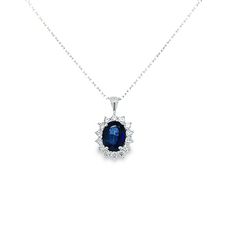 Estate-sapphire-and-diamond-halo-pendant-necklace Luxury Sapphire Oval Pendant Necklace, Oval Sapphire Diamond Necklace, Oval Sapphire Necklace With Brilliant Cut, Oval Sapphire Necklace With Halo Setting, Oval White Gold Sapphire Necklace, Oval Sapphire Necklace With Polished Finish, Halo Pendant, Rolo Chain, Oval Cut