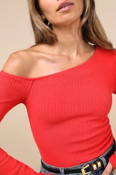 Keep serving the best 'fits on the daily with the Lulus Popular Babe Red Ribbed Knit Asymmetrical Long Sleeve Top! Stretchy ribbed knit shapes this chic little top with an asymmetrical, off-the-shoulder neckline and a fitted bodice, all framed by long sleeves. Pairs perfectly with your fave bottoms for an effortlessly cool 'fit! Fit: This garment fits true to size. Length: Size medium measures 21" from shoulder to hem. Bust: Great for any cup size. Waist: Fitted - stretchy fabric allows custom fit. Undergarments: May be worn with a strapless bra, adhesive bra, petals, or no bra. Fabric: Fabric is very stretchy. Unlined. 45% Rayon, 26% Polyester, 20% Nylon, 9% Spandex. Hand Wash Cold. Do Not Bleach. Line Dry. Iron Low Heat. Imported. Lulus | Popular Babe Red Ribbed Knit Asymmetrical Long Sl Ribbed Tops For Night Out In Spring, Spring Ribbed Top For Night Out, Trendy Ribbed One Shoulder Top, Spring Ribbed One Shoulder Top, One Shoulder Ribbed Top For Spring, Ribbed One-shoulder Top For Spring, Fitted Tops With Asymmetrical Neckline For Winter, Fitted One Shoulder Knit Top For Spring, Fitted One-shoulder Knit Top For Spring