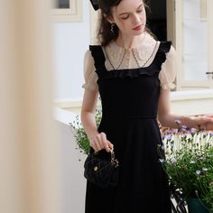 A docking dress that combines a blouse with embroidery on the collar and a jumper skirt with frills on the shoulder straps. Although it has a slender silhouette, it has a stretchy texture. The glossy black creates an elegant atmosphere. 
 
 Size 
 
 S size 
 
 Length: 116cm 
 Shoulder width: 33cm 
 Bust: 80-84cm 
 Waist: 62-70cm 
 Sleeve length: 22cm 
 
 M size 
 
 Length: 118cm 
 Shoulder width: 34cm 
 Bust: 84-88cm 
 Waist: 66-74cm 
 Sleeve length: 23cm 
 
 L size 
 
 Length: 120cm 
 Shoulder Cottagecore Clothes, Music Vibes, Cottagecore Outfits, French Dress, Picnic Dress, Simple Retro, Knitted Suit, Romantic Outfit, Cottagecore Dress