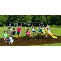 children are playing in the dirt on a swing set