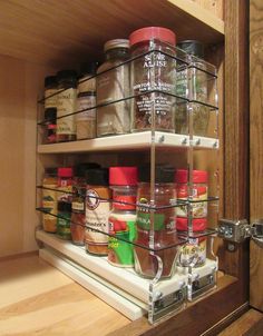 the spice rack in the kitchen is full of spices