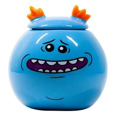 a blue toy with orange horns on it's head and mouth is shown in front of a white background