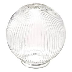 a clear glass vase sitting on top of a white table