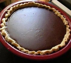 a chocolate pie sitting on top of a wooden table