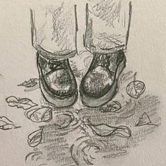 a drawing of two pairs of shoes on the ground