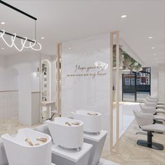 the interior of a hair salon with white chairs