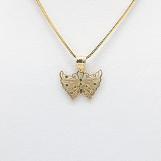 Created in 14k yellow gold, this openwork butterfly pendant is cute and dainty. This pendant is perfect for all the butterfly lovers out there! The chain pictured is for illustration purposes only and may be purchased separately. 14k solid yellow gold 13.9mm tall excluding bail x 19mm wide All measurements are approximate Chain is not included Product color may differ due to lighting 14k Yellow Gold Butterfly Pendant Necklace, 14k Gold Butterfly Pendant Necklace, Sterling Silver Yellow Gold Butterfly Pendant Necklace, 14k Gold Butterfly Charm Pendant Necklace, 14k Gold Butterfly Necklace Pendant, Butterfly Pendant, The Butterfly, Solid Yellow, Gold Necklace