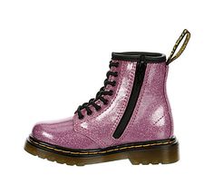 Dr. Martens 1460 Toddler Girls' Combat Boot She'll love the rugged chic style of the 1460 combat Boot from Dr. Martens. It features a rugged silhouette and a chunky in-your-face sole for serious grunge glam. She'll sparkle and dazzle in this fun and fashionable Boot. Synthetic upper Lace-up front  Cushioned insole Textured outsole Pink Dr Martens, Rack Room, Rack Room Shoes, Combat Boot, Girls Toddler, Dr. Martens, Toddler Girls, Fashion Boots, Combat Boots