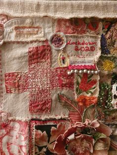 a close up of a piece of cloth with flowers on it and other things in the background