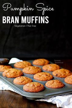 pumpkin spice bran muffins in a pan on a wooden table with text overlay