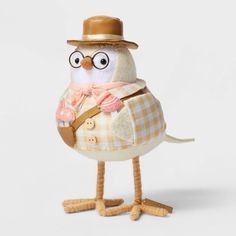 a stuffed bird wearing a hat and glasses