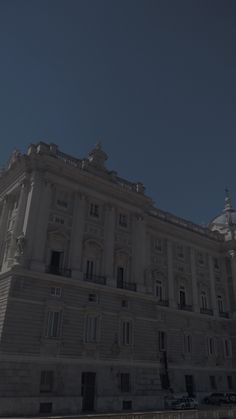 an old building is shown against the blue sky