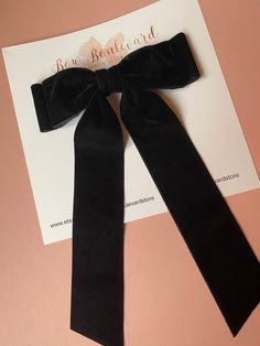 "Handmade double layer large velvet bow attached to a large alligator clip.  Bow measures approx 7\" wide x 10\" long This classic elegant black velvet bow compliments every outfit. It also makes a perfect gift." Chic Decorative Bow For Black Tie Events, Black Ribbon Bow For Evening, Black Decorative Bow Tie For Evening, Black Bow Tie With Decorative Bow For Evening, Classic Black Bow With Ribbon, Black Ribbon Bow Tie For Evening, Chic Black Bow Tie For Formal Occasions, Chic Black Ribbon Bow For Formal Events, Chic Black Bow For Black Tie Events