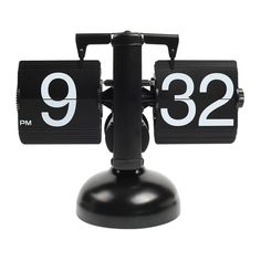 a black clock with two white numbers on it