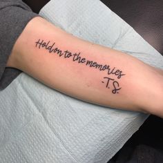 a person with a tattoo on their arm that says, hold me to the memories