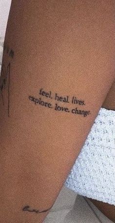 a woman's arm with a tattoo that reads, feel heal lives explore love change