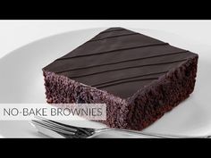 a piece of chocolate cake sitting on top of a white plate next to a fork