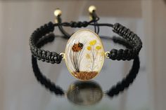 "✓ Personalized Hair Locket Cremation Bracelet With Flower & Soil/Ashes For Women, Our Solid 925 Sterling Silver Bracelet with %100 hand crafted, gold workmanship is specially produced for you, Jewelry made with love for your special occasions. ---● B R A C E L E T  ∙  D E T A I L S ●--- * The Balls In The Chain and Case Of The Hair Is SOLID 925 STERLING SILVER. * The Top Of The Hair is made of UV stable resin. And your hair will be safe in it. * Current production time is 4 to 8 business days f Unique Resizable Bracelets For Gift, Unique Braided Bangle Bracelets As Gifts, Unique Braided Bangle Bracelets For Gifts, Elegant Handmade Braided Bracelets As Gifts, Elegant Handmade Braided Bracelets For Gifts, Adjustable Handmade Nature-inspired Bangle, Adjustable Nature-inspired Bangle As A Gift, Handmade Braided Bangle Bracelets As Gifts, Handmade Nature-inspired Bracelets As Gifts