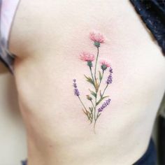 a woman's stomach with pink flowers on it