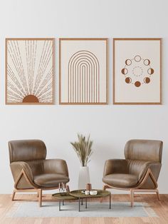 two brown chairs sitting next to each other on top of a hard wood floor in front of a white wall