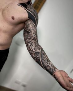 a man with a tattoo on his arm