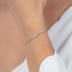 Experience timeless elegance with our Sterling Silver 2mm Fine Tennis Bracelet! Made with high-quality sterling silver, this delicate bracelet is perfect for everyday wear or special occasions. Its 2mm width adds a touch of sophistication to any outfit. Feel confident and stylish with this must-have accessory! 100% Fine Sterling Silver Silver Tennis Bracelet, Gifts For Swimmers, Artisan Gift, Grandmother Gifts, Zodiac Jewelry, Solid Gold Jewelry, Tennis Bracelet, Gifts For Mum, Feel Confident