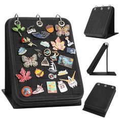 an assortment of pins and magnets on a black case with clippings attached