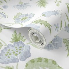 a floral wallpaper with blue and green flowers on white background, showing the pattern