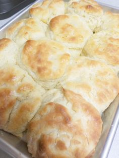 freshly baked bread sitting on top of a pan