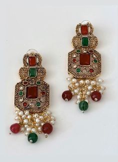 A light weight, south asian inspired multi-color stone earrings which will perfectly elevate any style. Made with exquisite materials, these minimalistic pearl earrings are a perfect blend of sophistication, elegance and durability. Due to the one-of-a-kind nature of the medium, exact colors and patterns may vary slightly from the image shown. Measurements (L x W): 3 inches x 1 inches Estimated Delivery: 3-4 Days. Elegant Multicolor Earrings For Formal Occasions, Elegant Pearl Earrings With Stone Work As Gift, Elegant Pearl Earrings With Stone Work For Gift, Gift Pearl Drop Earrings With Stone Work, Gift Stone Work Pearl Drop Earrings, Elegant Pearl Earrings With Stone Work, Elegant Stone Work Pearl Earrings, Traditional Festive Beaded Pearl Drop Earrings, Traditional Festive Beaded Earrings With Pearl Drop