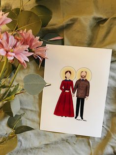 a card with an image of two people holding hands, and flowers in the background