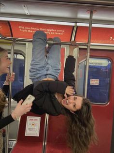 two women on a train with their legs up