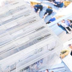 several clear plastic containers filled with family photos