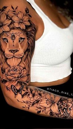 a woman with a lion tattoo on her arm