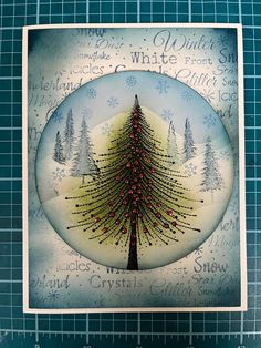 a christmas card with a tree in the middle