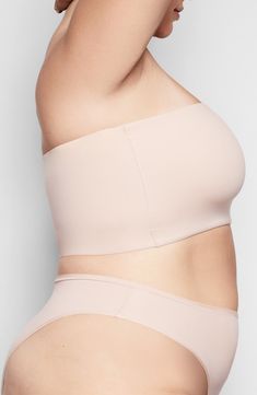 Your favorite loungewear has finally met its match with this bandeau from Kim Kardashian West's SKIMS that stretches across curves with second-skin softness. Available in nine different tones, this quick-drying and smoothing bralette is great for layering under airy clothing pieces or wearing at home. Style Name:Skims Fits Everybody Bandeau Bralette (Regular & Plus Size). Style Number: 6016409. Micro-elastic Sports Bra With Built-in Bra, Solid Sculpting Bra With Built-in Support, Workout Bandeau Tube Top With Built-in Bra, Beige Stretch Sports Bra With Built-in Bra, Fitted Full Coverage Seamless Bra, Seamless Full Coverage Fitted Bra, Seamless Fitted Full Coverage Bra, Seamless Compressive No-show Bra, Supportive Seamless Nylon Shapewear